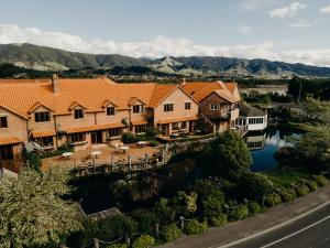 an aerial view of a house with a river at Grand Arden Monaco Nelson in Nelson