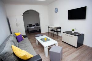 a living room with a couch and a table at Villa Beautiful in Gevgelija