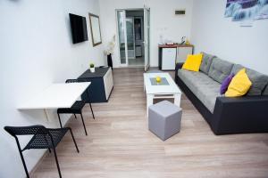 a living room with a couch and a table at Villa Beautiful in Gevgelija