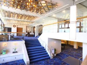 a staircase in a building with a lobby at Lakeland Hotel Mizunosato in Fujikawaguchiko