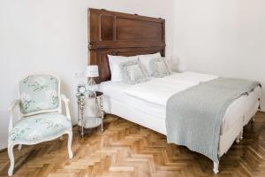 Een bed of bedden in een kamer bij House Beletage-Boutique Hotel