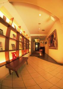 a hallway with a bench in a building at Hotel Dio (Adult Only) in Osaka