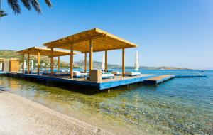 a pavilion on a dock in the water at The Marmara Bodrum - Adult Only in Bodrum City