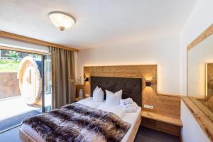 Łóżko lub łóżka w pokoju w obiekcie Viktoria Lodges