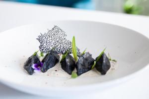 a plate of food on a white plate at Matejki 8 in Szczecin