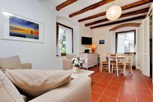 a living room with a couch and a table at Agriturismo Pimpinnacolo in Porto Ercole