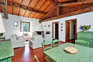 a living room with a table and chairs at Agriturismo Pimpinnacolo in Porto Ercole