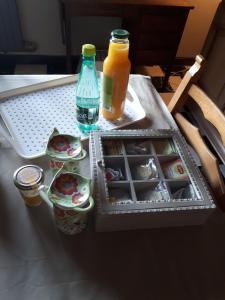 a table with a tray of food and drinks on it at Escale de Brionsart in Gesves