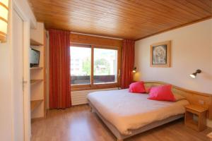 Postel nebo postele na pokoji v ubytování Hotel le Sherpa