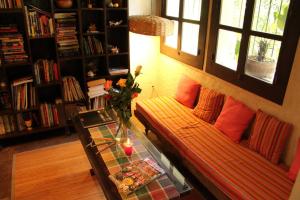 a living room with a couch and a table at Baraka Antigua in Antigua Guatemala