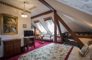 Postel nebo postele na pokoji v ubytování Hotel Belle Epoque