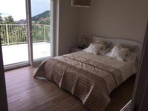 a bedroom with a bed and a large window at Villa Carmen in Opatija +38 photos