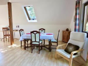 a dining room with a table and chairs at Natururlaub Frankenau in Frankenau