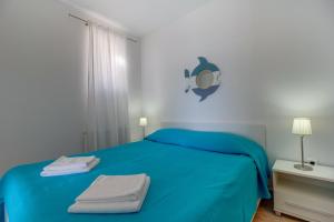 מיטה או מיטות בחדר ב-Apartments Del Sole