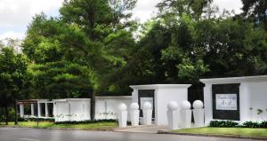 a white building with white globes on the side of a street at Farquhar Lodge in Ladysmith