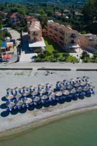 a group of boats are lined up on the beach at Akroyiali Resort in Vasiliki