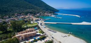an aerial view of a beach with boats in the water at Akroyiali Resort in Vasiliki