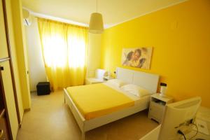 Postel nebo postele na pokoji v ubytování B&B LA BAIA Sea Rooms