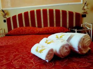 Postel nebo postele na pokoji v ubytování Hotel Sicilia