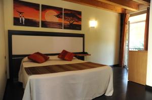 Postel nebo postele na pokoji v ubytování Hotel Villa Altura