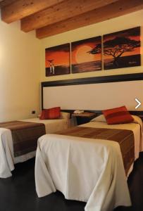 Postel nebo postele na pokoji v ubytování Hotel Villa Altura