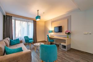 TV a/nebo společenská místnost v ubytování Hotel Regnum Residence
