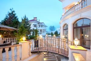 a balcony of a house with lights on it at Villa Le Premier in Odesa