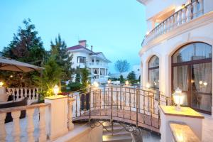 a balcony of a house with lights on it at Villa Le Premier Maestro in Odesa