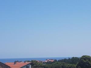 a view of the ocean from a house at Apartmenti Smokiniya in Ahtopol