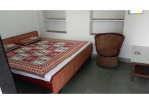 Tempat tidur dalam kamar di Shri Shyam Krishna Guest House