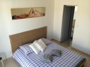 מיטה או מיטות בחדר ב-Villa Des Romieux