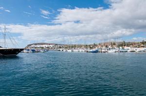 a group of boats docked in a harbor at Villas Pasito Blanco in Pasito Blanco +64 photos