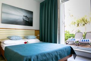 Rúm í herbergi á Hotel Laguna - Terme Krka