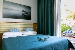 Rúm í herbergi á Hotel Laguna - Terme Krka