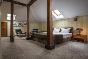 Postel nebo postele na pokoji v ubytování Boutique Hotel Uniqato + 37 fotografií
