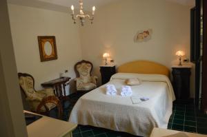 Postel nebo postele na pokoji v ubytování Hotel Santa Lucia