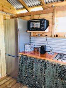 Kuchyň nebo kuchyňský kout v ubytování Bungalow de charme vue mer