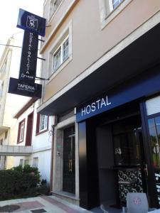 a hospital building with a sign in front of it at Hostal Galicia Arteixo in Arteixo