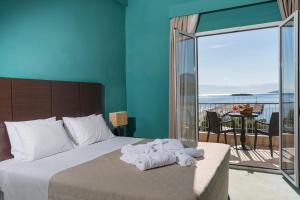 Postel nebo postele na pokoji v ubytování Galini Hotel
