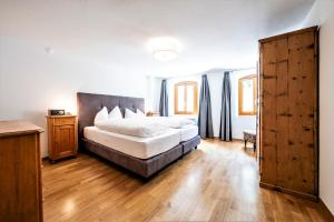 Postel nebo postele na pokoji v ubytování Hotel Münsterhof