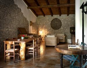 a living room with a wooden table and a couch at La Corte Di Nando in Varzi