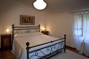 A bed or beds in a room at La Corte Di Nando