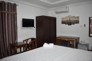 Tempat tidur dalam kamar di Cascade Hotel