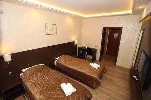 Voodi või voodid majutusasutuse Hotel Petrus toas