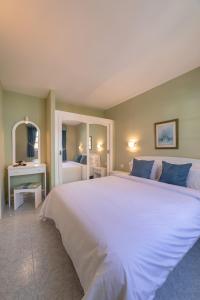 Un pat sau paturi într-o cameră la Club Vista Serena