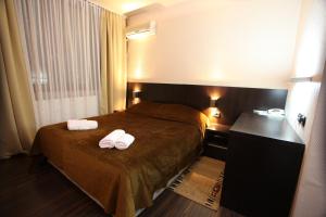 Voodi või voodid majutusasutuse Hotel Petrus toas