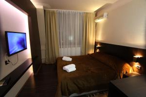 Voodi või voodid majutusasutuse Hotel Petrus toas