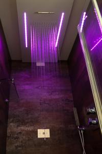 a room with purple lights on the ceiling at Brunelleschi Luxury Holidays in Rome