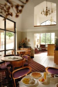 a room with tables and chairs with food on them at Branson's Best in Branson