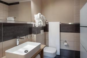 Koupelna v ubytování Hotel Beau Rivage